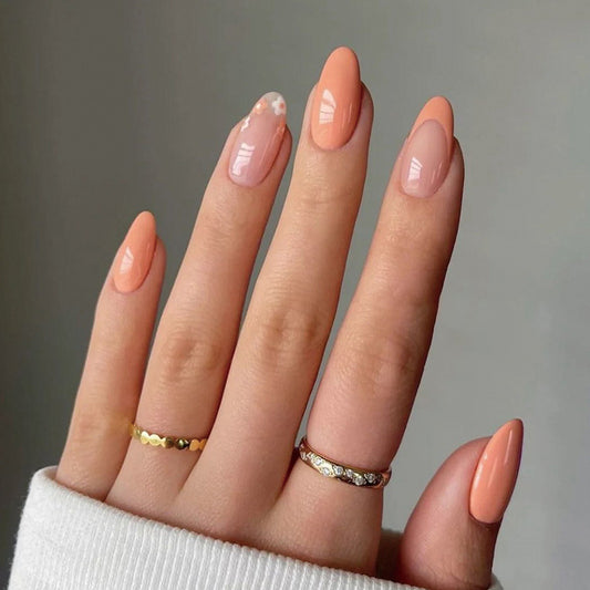 Elegant Peach Oval Gel Nails with Delicate Floral Accent for a Stylish Manicure